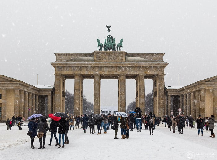 Berlin around the Brandenburg Gate in the winter showing people and snow