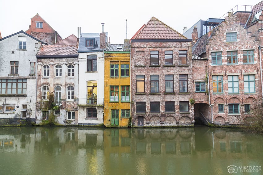 Old architecture along the river Leie