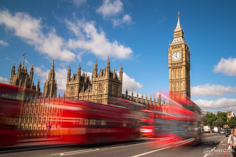 Big Ben in Westminster with typical London Buses