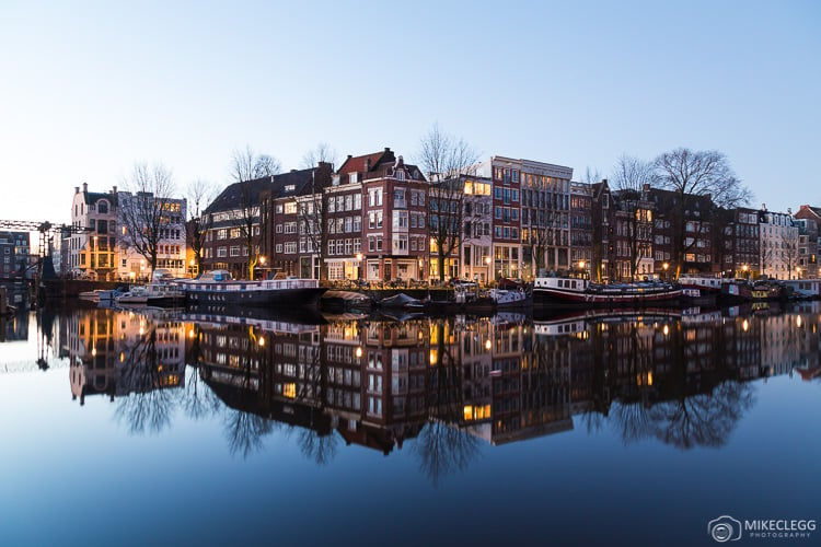 City skylines from across rivers and canals