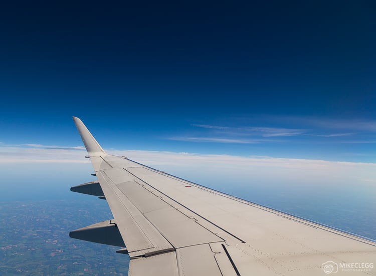 View out of a plane towards the wing whilst flying