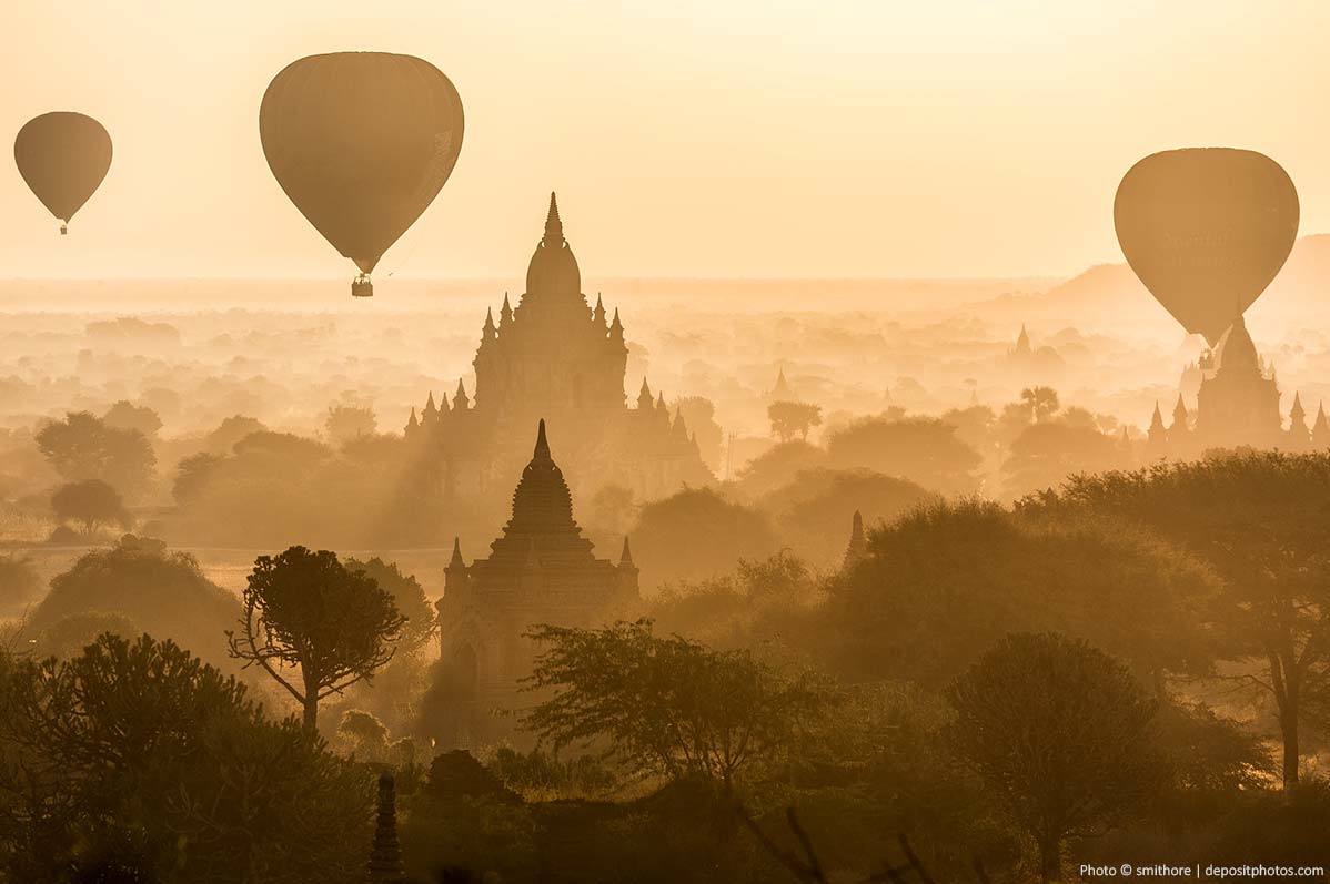 Balloons and temples at sunrise
