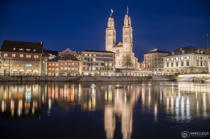 View across Limmat towards the Grossmünster Church at night