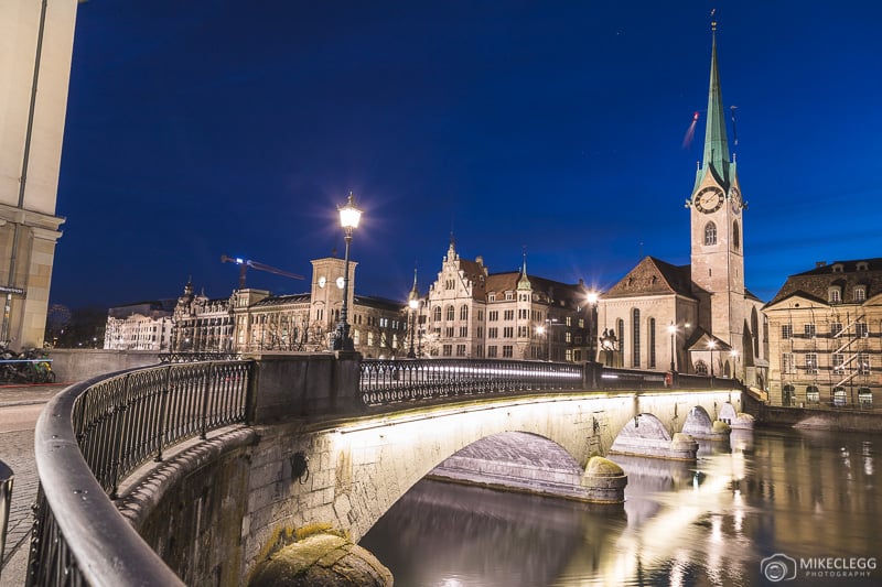 View over Münsterbrücke towards Fraumünster Church at night