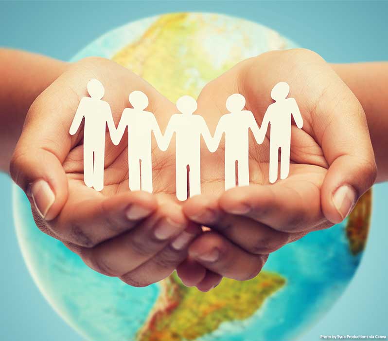 People holding hands and helping each other around the world - concept