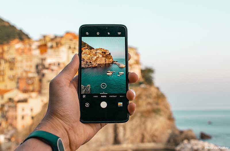 Taking pictures at a travel destination on a smartphone