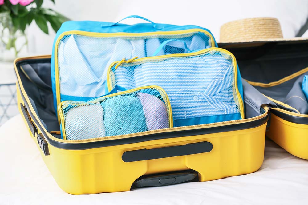 Travel organisers and a suitcase